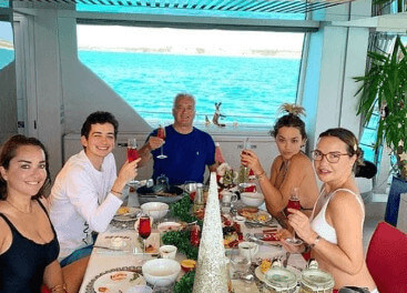 Elena Ora with her family on a trip